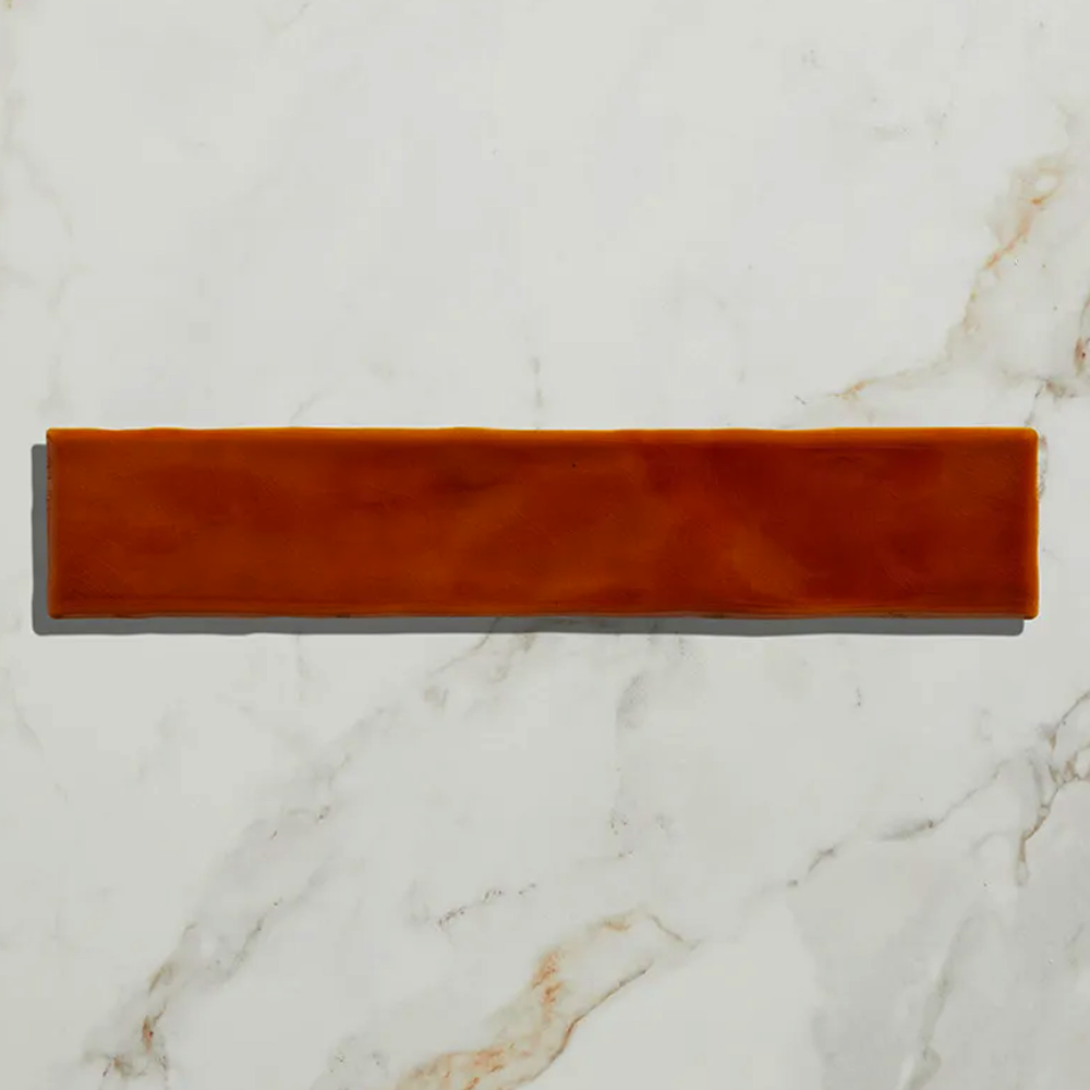 Rectangular brown tile on a marble surface