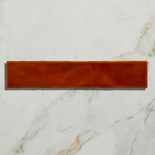 Rectangular brown tile on a marble surface