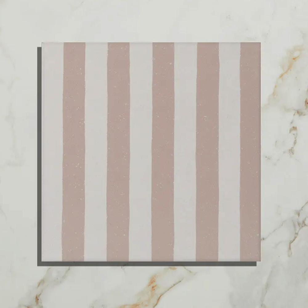 Striped fabric swatch with horizontal brown and white stripes on a marble background