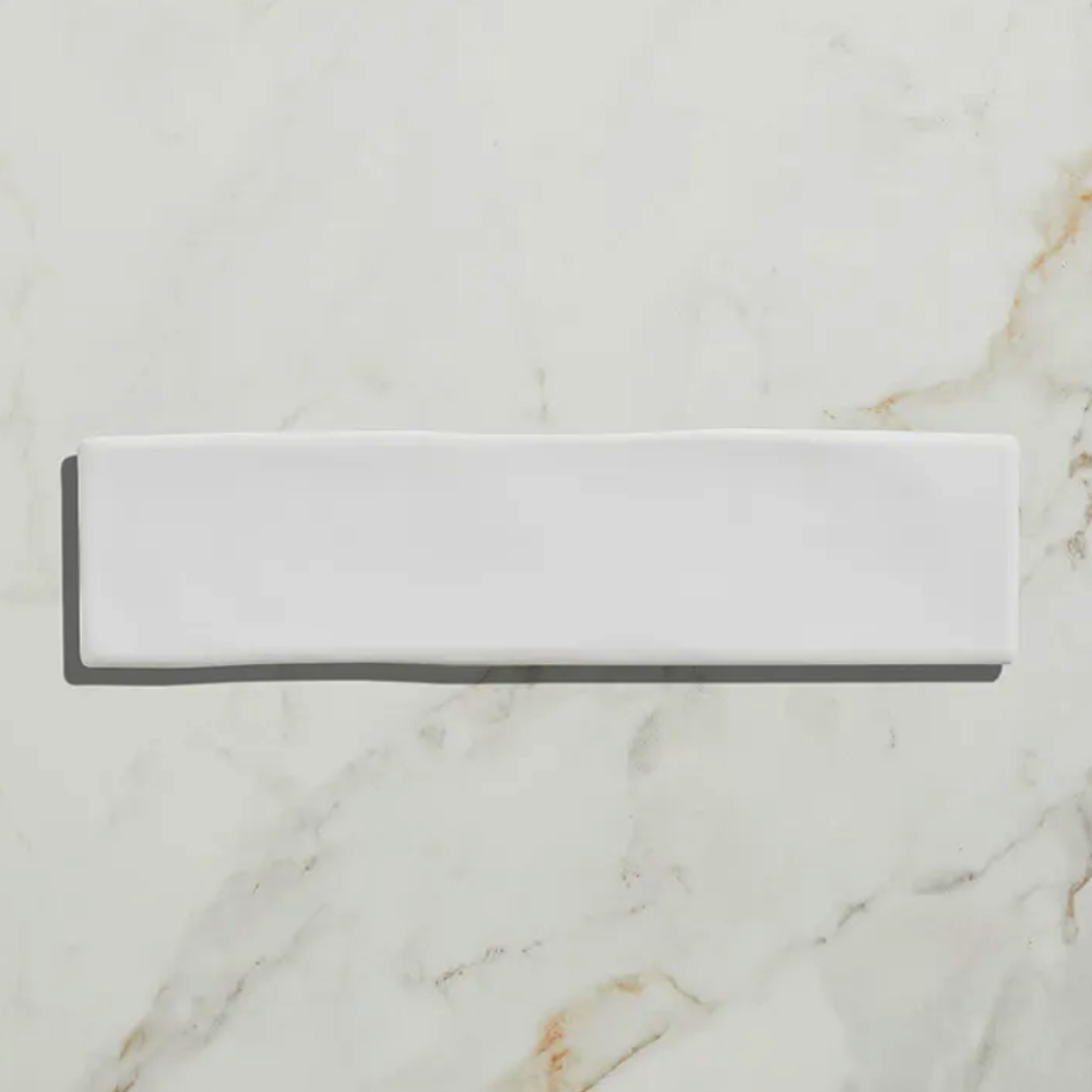 Rectangular white stone slab on a marble background