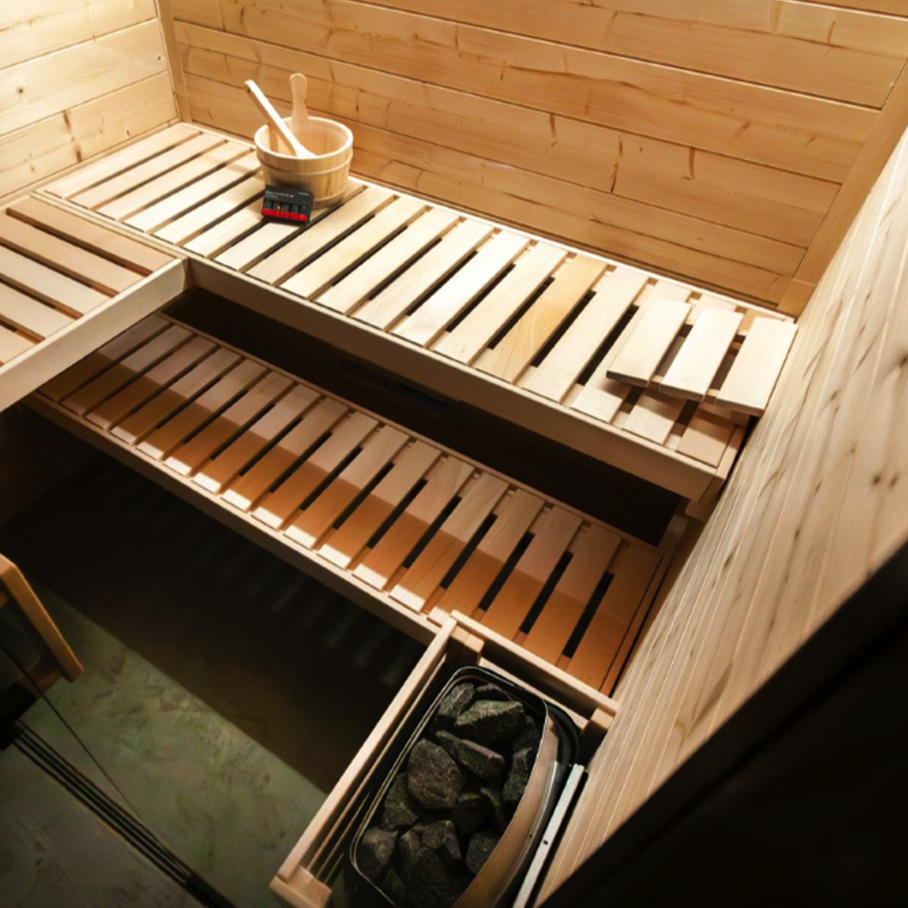 Wooden sauna interior with a shelf and basket on a wooden wall.