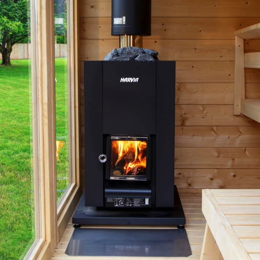 Wood-burning stove with visible brand name in a wooden cabin setting