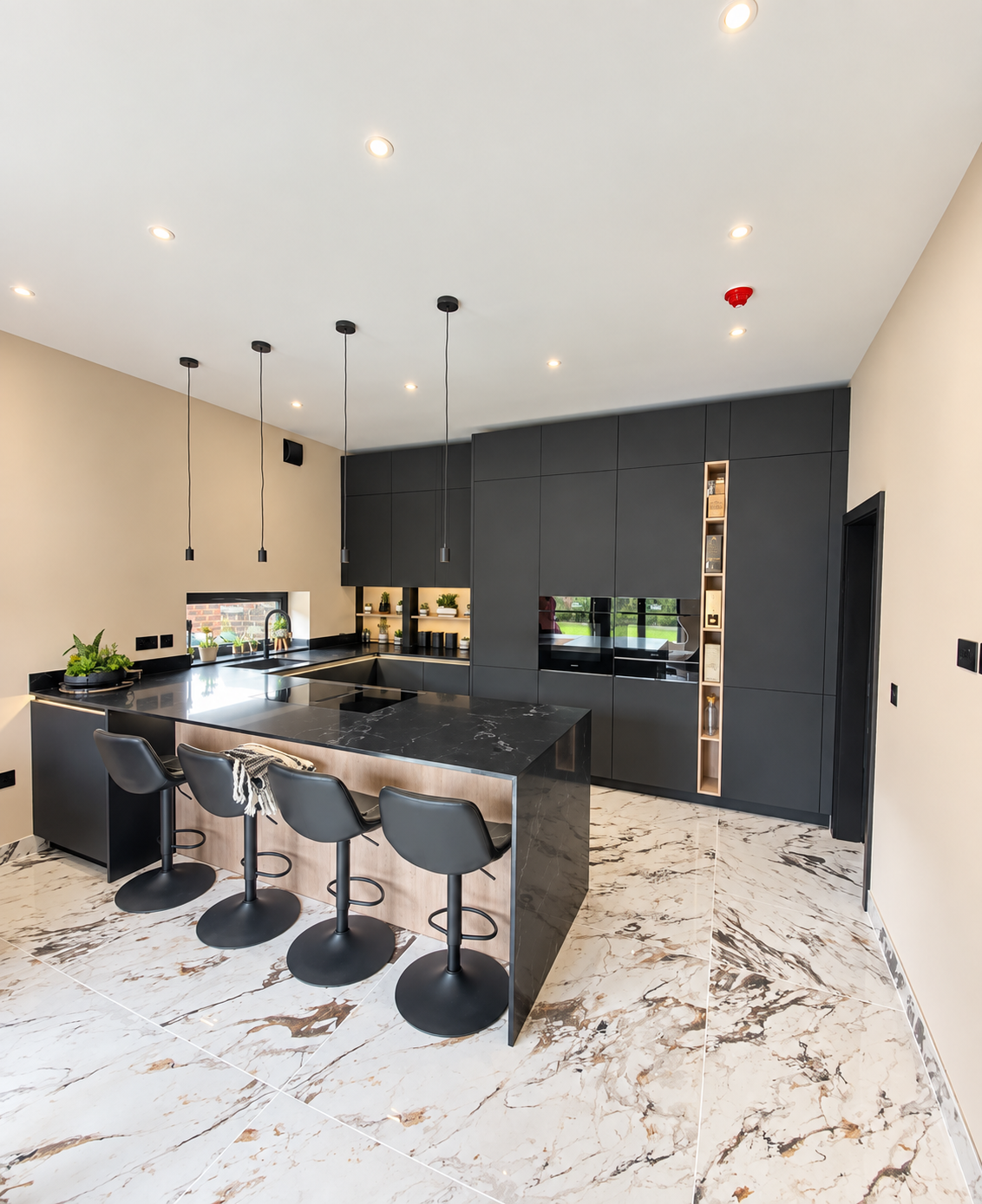 A Bold Handleless Kitchen in Graphite and Marble