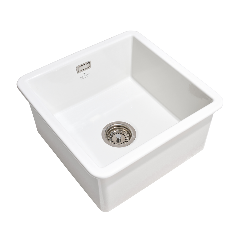 White kitchen sink with drain on a white background