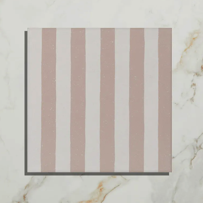 Striped fabric swatch with horizontal brown and white stripes on a marble background