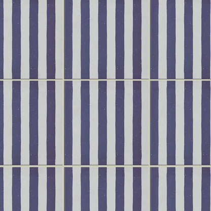 Pattern of blue and white vertical stripes on a tiled background