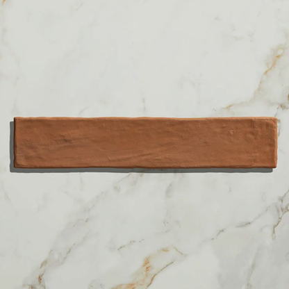 Rectangular wooden coaster on a marble surface