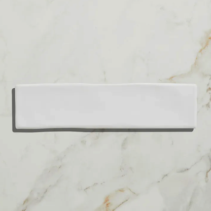 Rectangular white stone slab on a marble background
