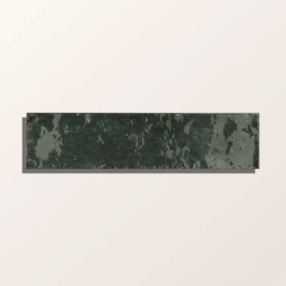 Rectangular green marble tile on a beige background