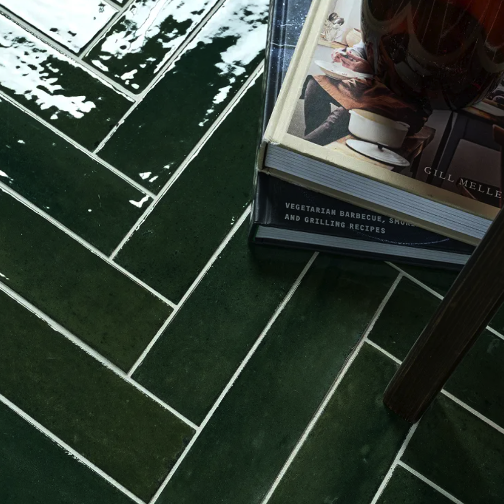 Book titled 'Vegetarian Barbecue, Spice and Grilling Recipes' by Gill Meller on a green tiled floor.