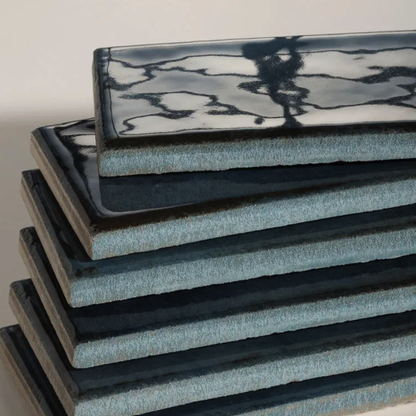 Stack of blue foam mats on a light background