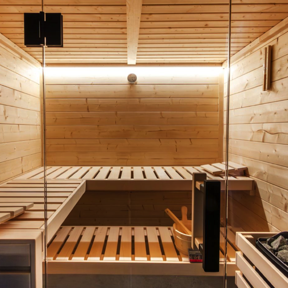 Wooden sauna with glass door and interior benches.