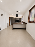 Microstone Poured Floor in Limestone – open-plan kitchen floor