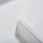 Close-up of a white hexagonal tile with a subtle pattern