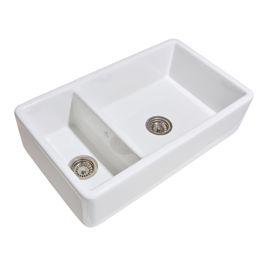 White ceramic kitchen sink with two drainholes on a white background