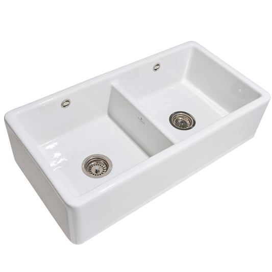 White ceramic kitchen sink with two basins on a white background