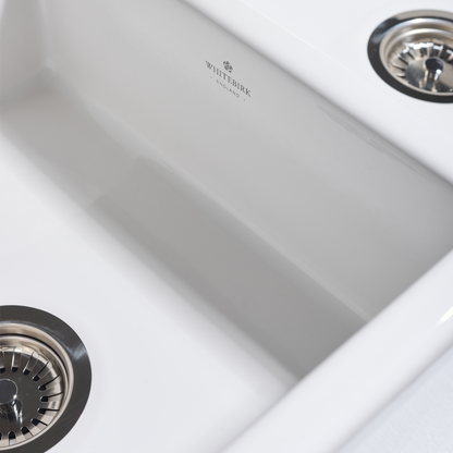 Close-up of a stainless steel kitchen sink with Whiterock branding.