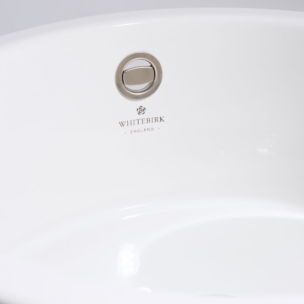 Close-up of a white product with 'Whitebirk' branding on a light gray background