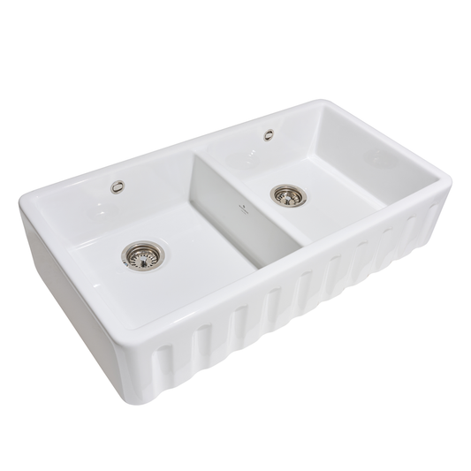 White ceramic double-basin kitchen sink on a white background