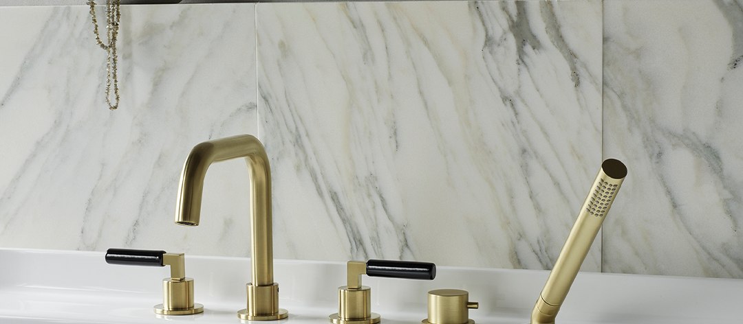 Coalbrook Zurich deck mounted bath set in brushed brass with black ceramic levers
