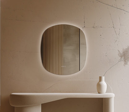 Origins Living Claris Curve Oblong LED Mirror in a bathroom setting