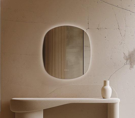Origins Living Claris Curve Oblong LED Mirror in a bathroom setting