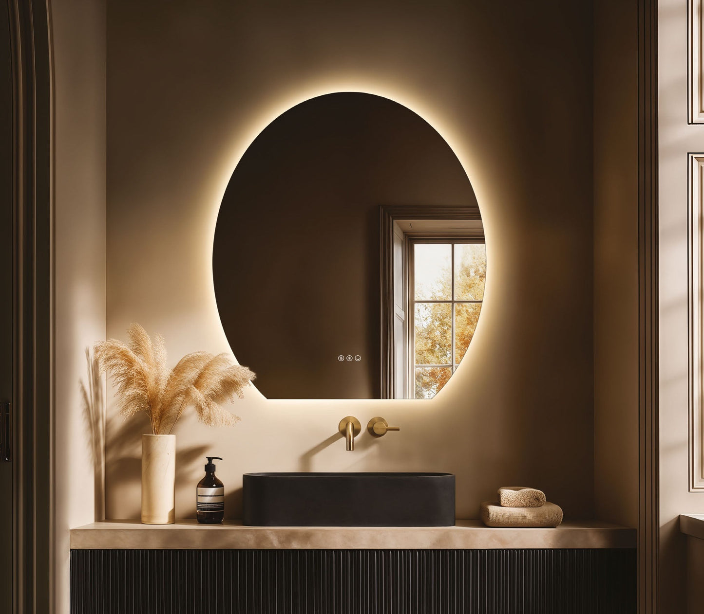 Origins Living Claris Oval Cut LED Mirror in a bathroom setting