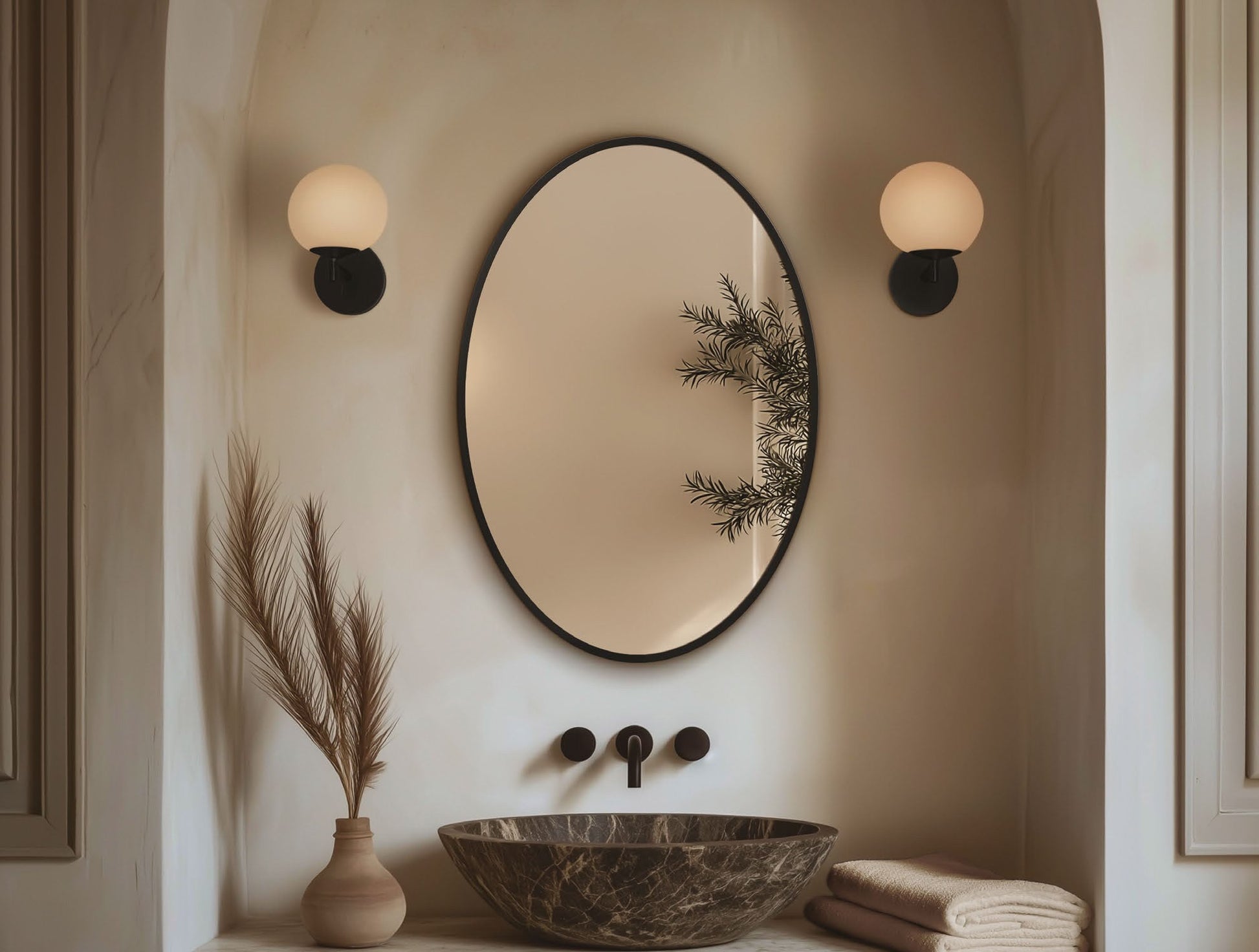 Origins Living Delphine Oval Mirror in a bathroom setting