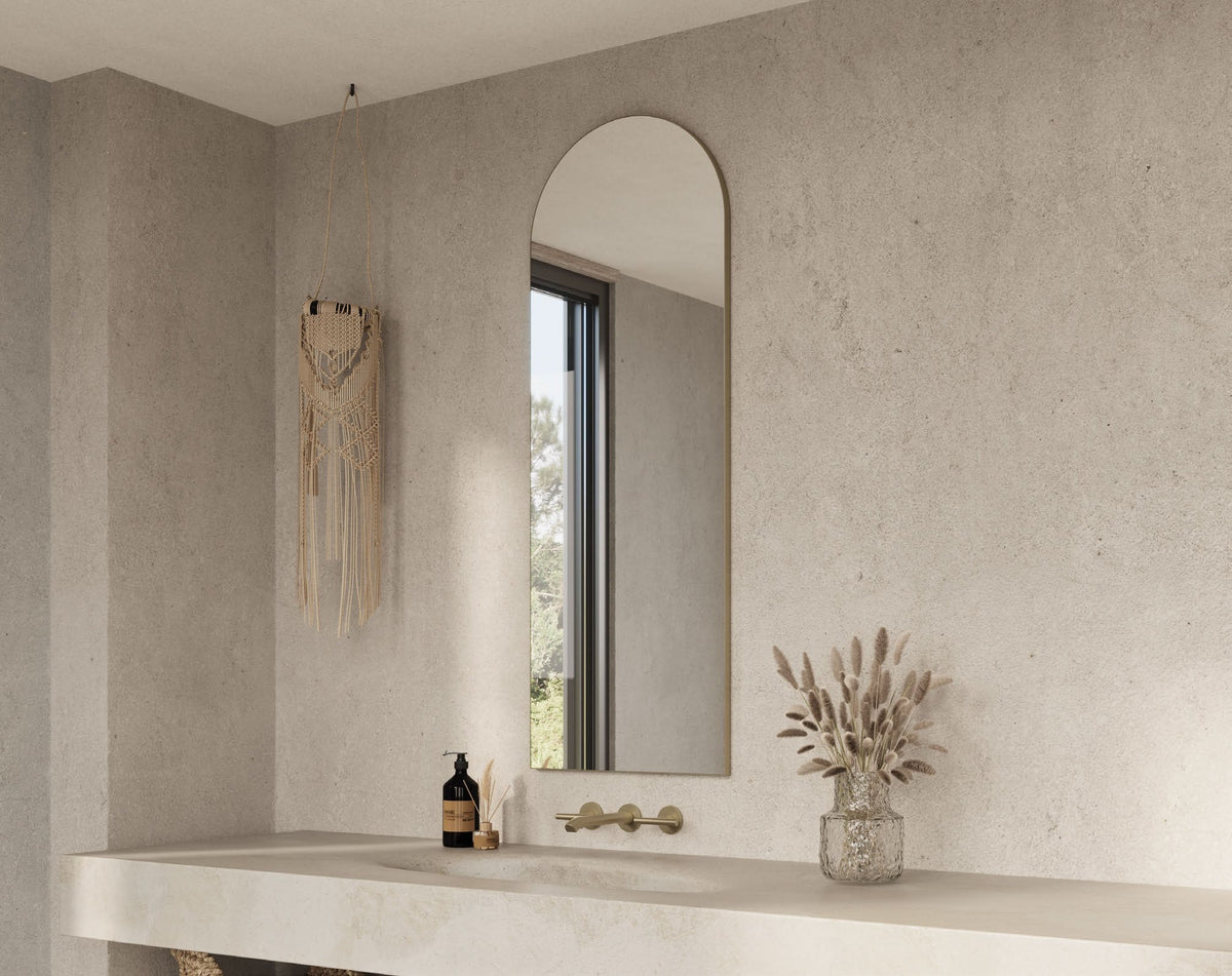 Origins Living Oslo Arch Mirror in a bathroom setting