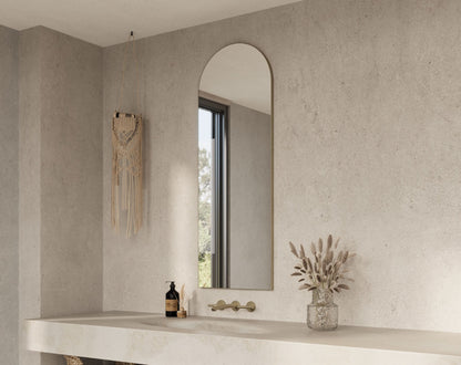 Origins Living Oslo Arch Mirror in a bathroom setting