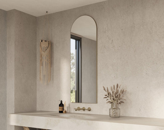 Origins Living Oslo Arch Mirror in a bathroom setting