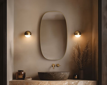 Origins Living Oslo Barrel Mirror in a bathroom setting