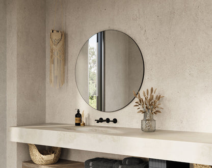 Origins Living Oslo Round Mirror in a bathroom setting
