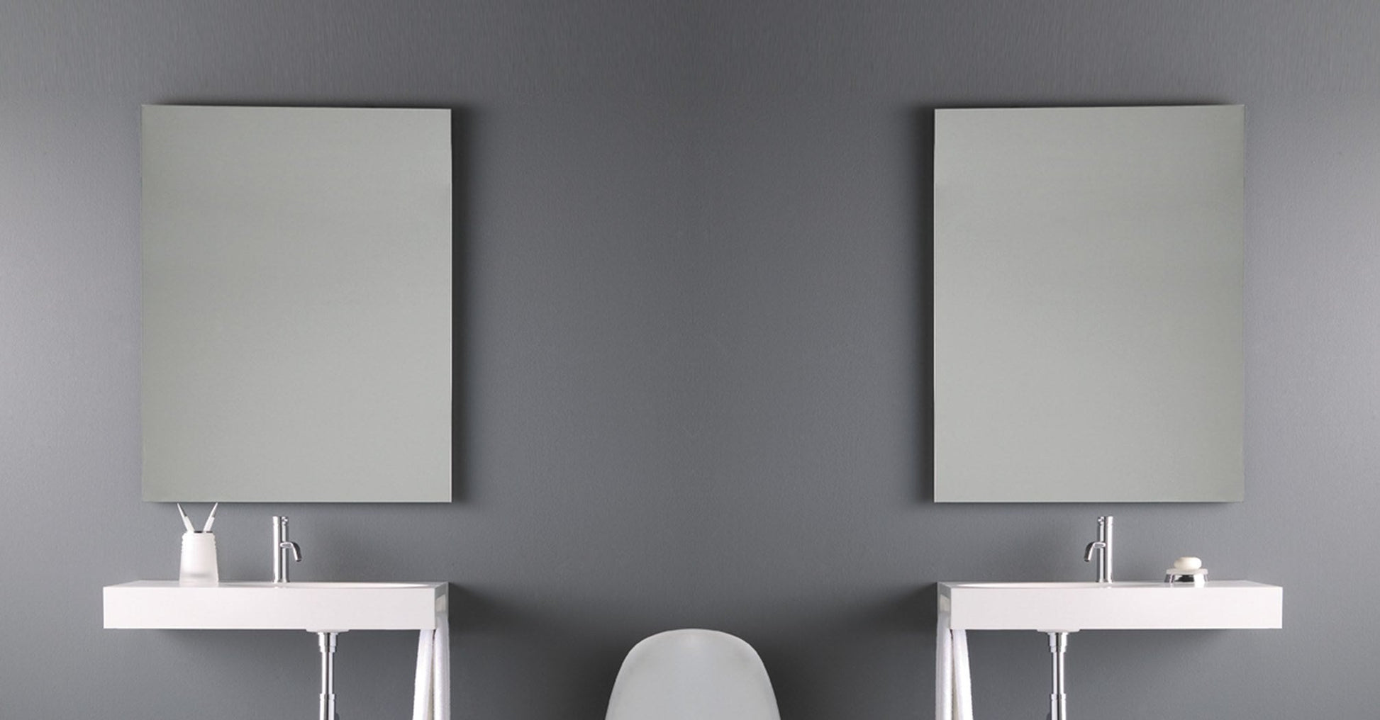 Origins Living Slim Rectangular Mirror in a bathroom setting
