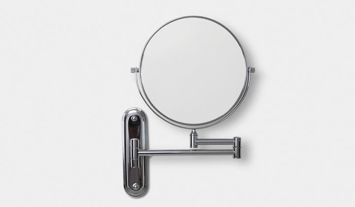 Origins Living Taylor Reversible 5x Magnifying Wall Mirror in a bathroom setting