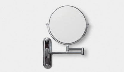 Origins Living Taylor Reversible 5x Magnifying Wall Mirror in a bathroom setting