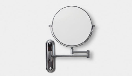 Origins Living Taylor Reversible 5x Magnifying Wall Mirror in a bathroom setting