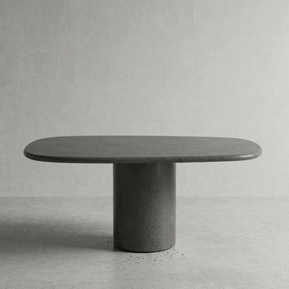 Microcement dining table in Antracita, a near-black charcoal finish