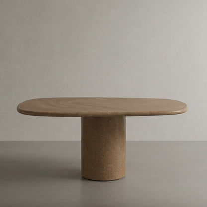 Microcement dining table in Arena, a warm ochre sand finish