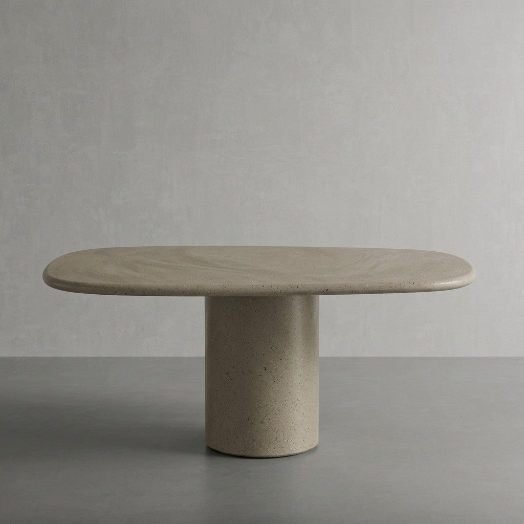 Microcement dining table in Hueso, a pale warm bone finish