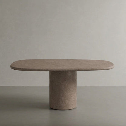 Microcement dining table in Plata, a warm mid grey finish