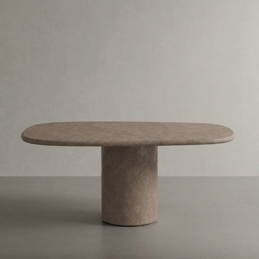 Microcement dining table in Plata, a warm mid grey finish